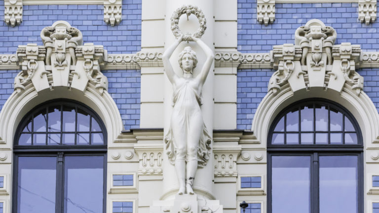 Art Nouveau style architecture locally known as Jugendstil, Riga, Latvia with white statutes and detail on a blue brick buildling