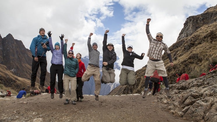 group shot with everyone jumping on inca trail trek land tour in peru