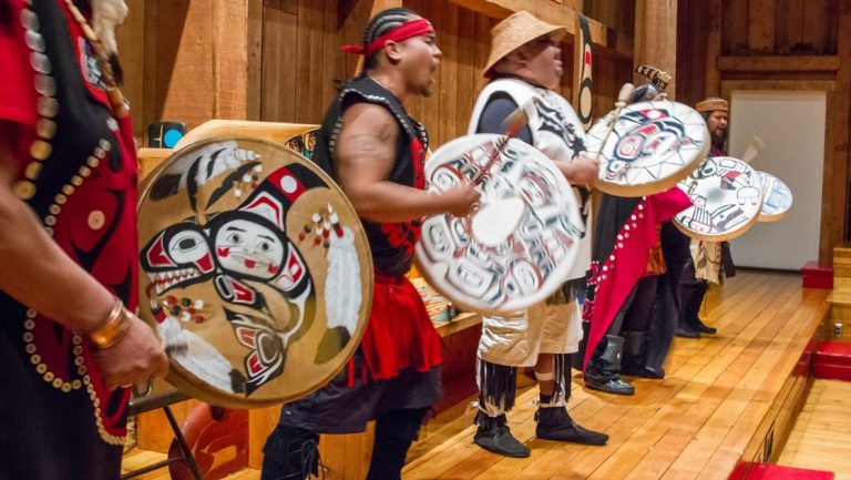 Men from the Metlakatla Indian Community on Annette Islands the only Indian Reserve in the State of Alaska dress in tribal garb and preform native Alaskan dance ritual.