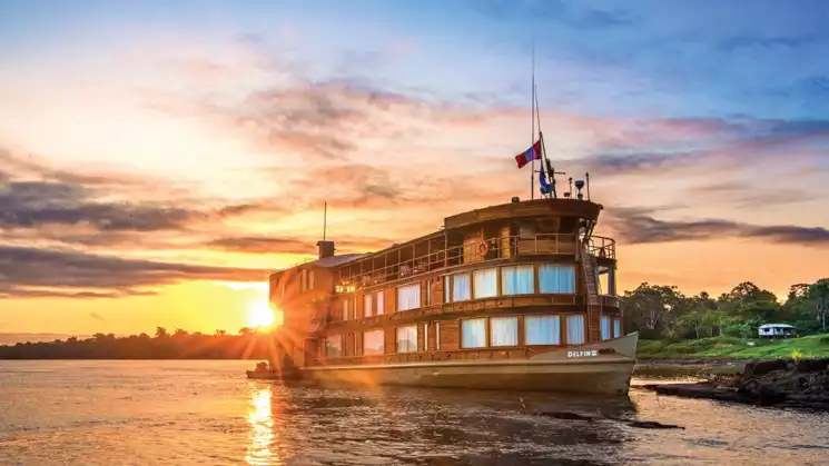 You will be aboard the Delfin II as seen here docked while with the National Geographic Upper Amazon River Cruise