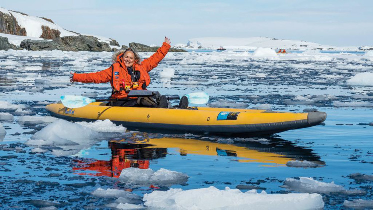 Here we see an adventurer kayaking while cruising on the National Geographic Antarctica, South Georgia and The Falklands cruise