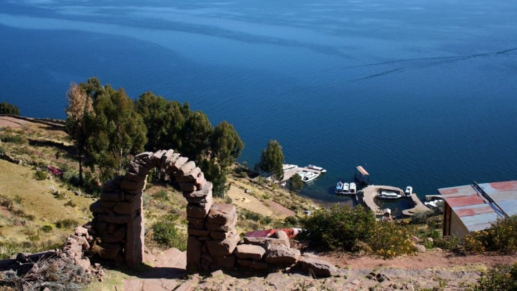 mountaintop view of lake seen on puno & lake titicaca land tour in peru