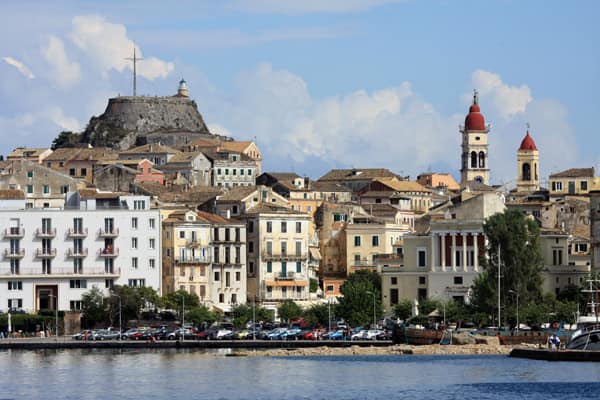 View of small ship cruise approaching Corfu's old town and fortress on an Adriatic Cruise.