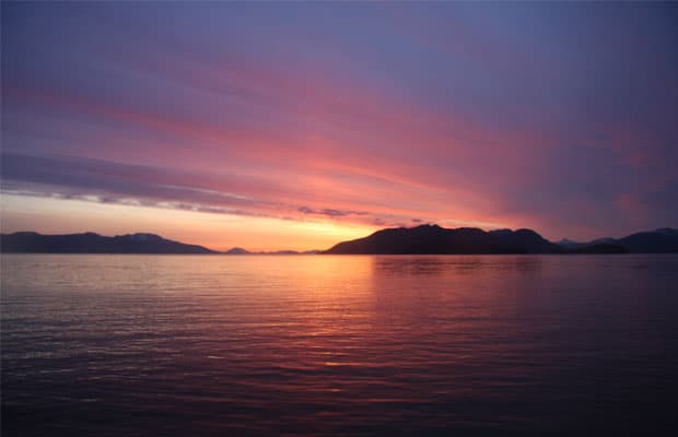 vibrant colors in the sky at sunset seen from an alaska small ship cruise