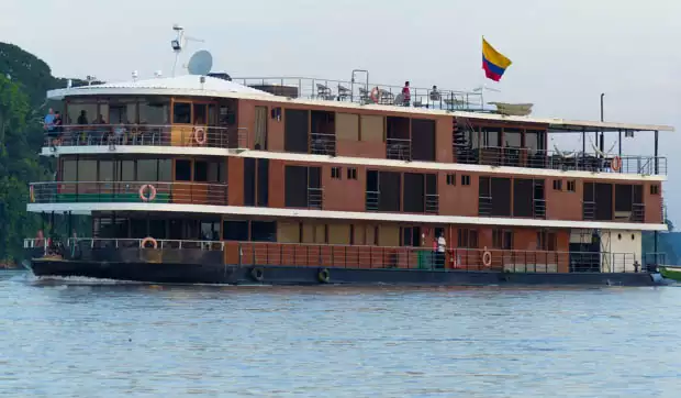 The Anakonda small ship motoring up the Ecuadorian Amazon river. 