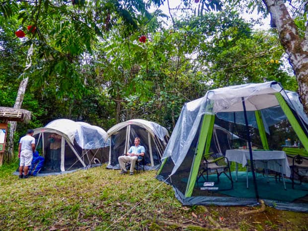 A man and crew glamping in the Ecuadorian Amazon jungle. 