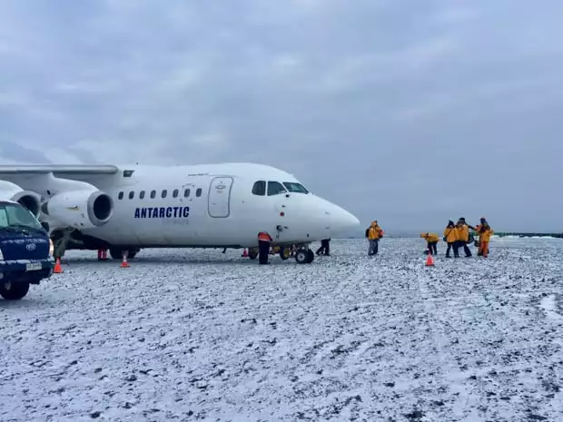 Guests disembarking plane that landed on Antarctica. 