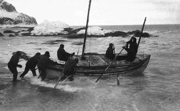 Black and white photo of the James Caird expedition Launching from Elephant Island on April 24, 1916. 