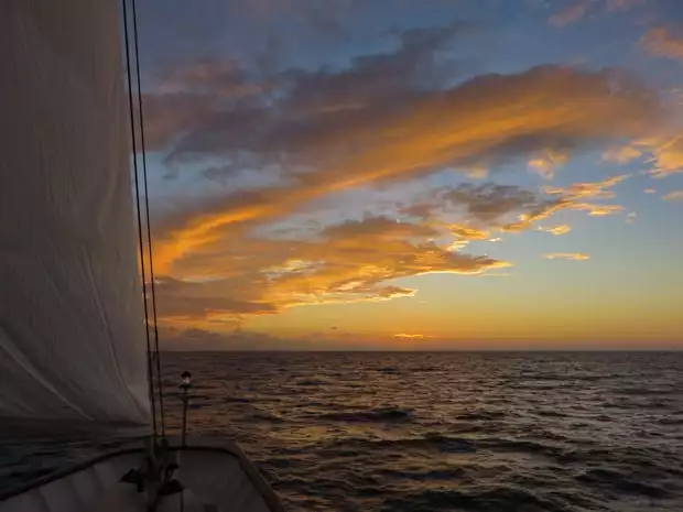 Sunset from the bow of a small ship sailing in Cuba. 