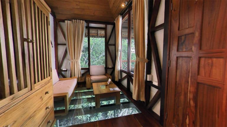 The glass floor inside the living room of the Panoramic Suite lets guests view wildlife below, at the Napo Wildlife Center, a luxury eco lodge surrounded by a rainforest biosphere reserve in the Ecuadorian Amazon.