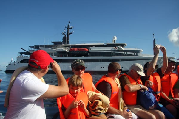 Guests on a skiff in front of their small ship Costa Rica and Panama cruise. 