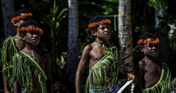 Local village children dressed in tribal wear in Indonesia. 