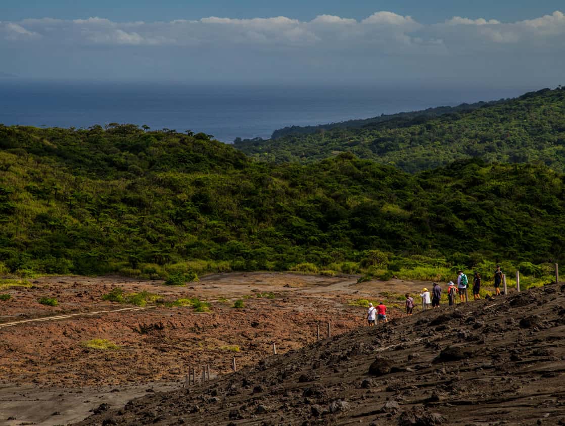 Guests from a small ship cruise hiking on an island in the south pacific. 