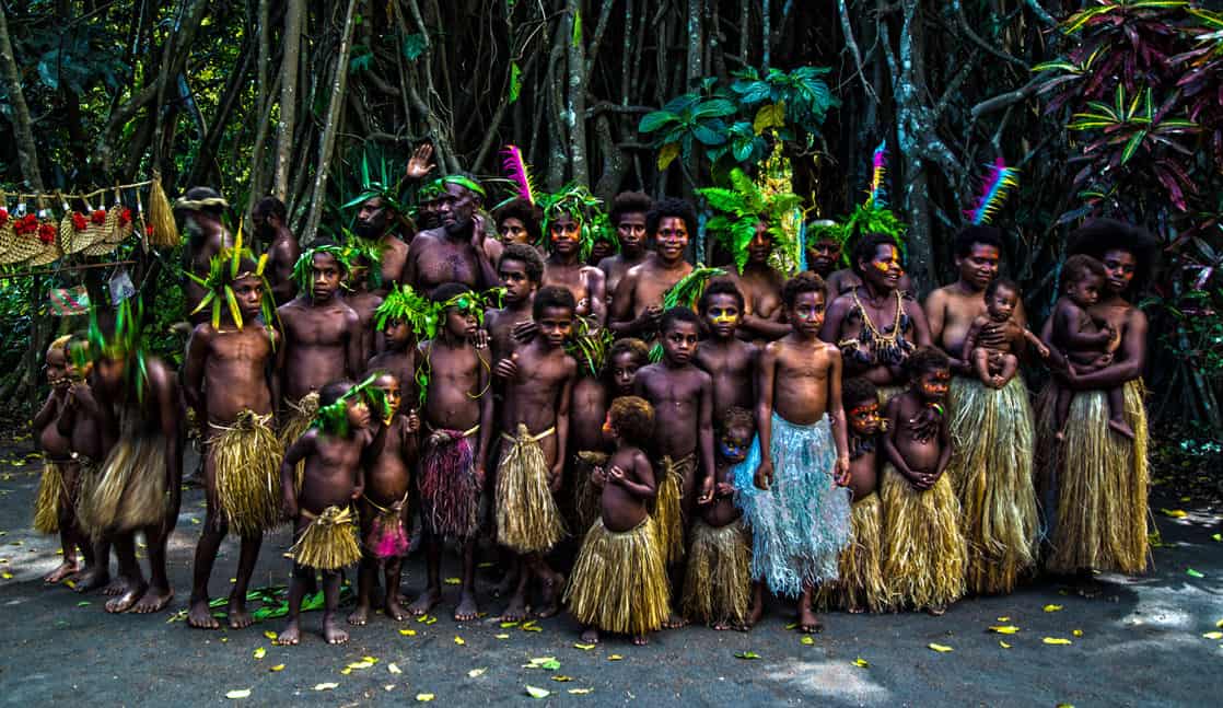 Local group of villagers in the South Pacific seen from a small cruise ship excursion. 