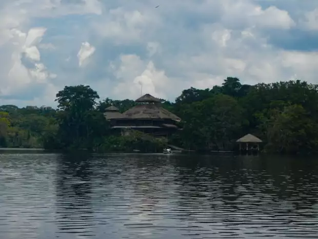 View from the water of the La Selva Lodge on the shoreline of the Amazon jungle.