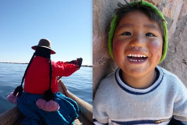 Local Peruvian woman canoeing in a reed boat with large pink pom poms hanging from her pig tails and a young Peruvian boy smiling.