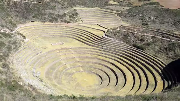 Ancient terraced stone ruin on a Peruvian land tour.