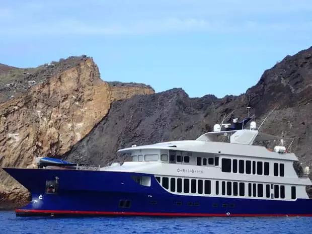 Close up look at the small ship cruise Origin anchored off the coast of the Galapagos.