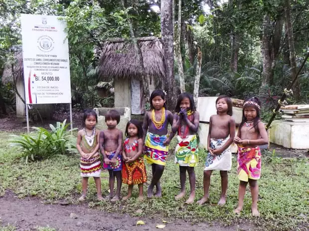 Local children from a village in the Darien Jungle greeting guests on tour from their small ship cruise in Panama. 