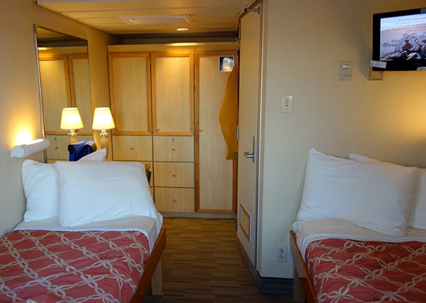 Stateroom with 2 twin beds, closet, drawers and tv on a Uncruise small ship cruise in Baja.