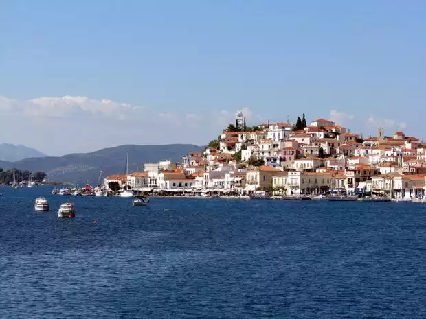View from a small ship cruise of a town on the hillside in Greece. 