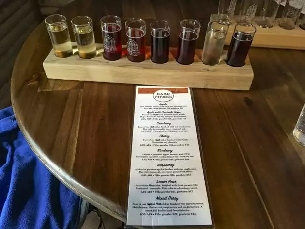 Flight of hard cider samples on a tour off a pacific northwest river cruise. 