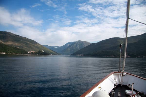 Bow of a small ship cruising through the Bay of Kotor in Montenegro. 