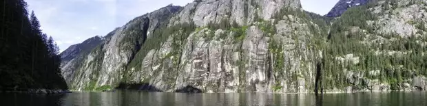 A scenic Alaskan fjord with granite sheer rock.