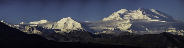 Denali mountain in full view with blue skies in Alaska.