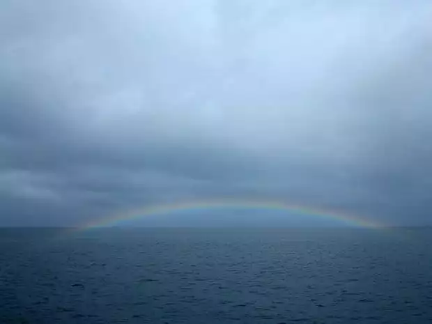 Rainbow seen from a small ship cruise in Alaska. 