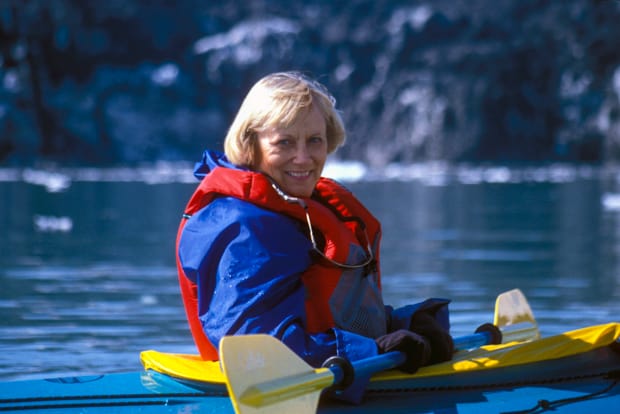 Passenger on a small ship cruise in Alaska on a kayak excursion. 