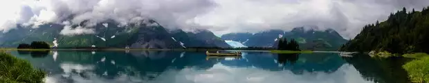 Canoeing in front of a glacier from a wilderness lodge in Kenai Fjords Alaska. 