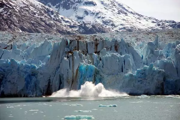 Dawes Glacier calving in Alaska as seen from a small ship cruise. 