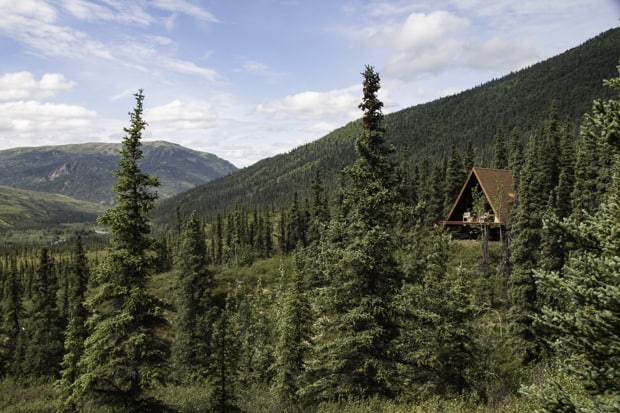 An a-frame remote wilderness Lodge amid the forest on a land tour to Denali National Park in Alaska. 