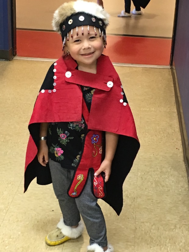 Tlingit child performer in traditional clothes in Alaska. 