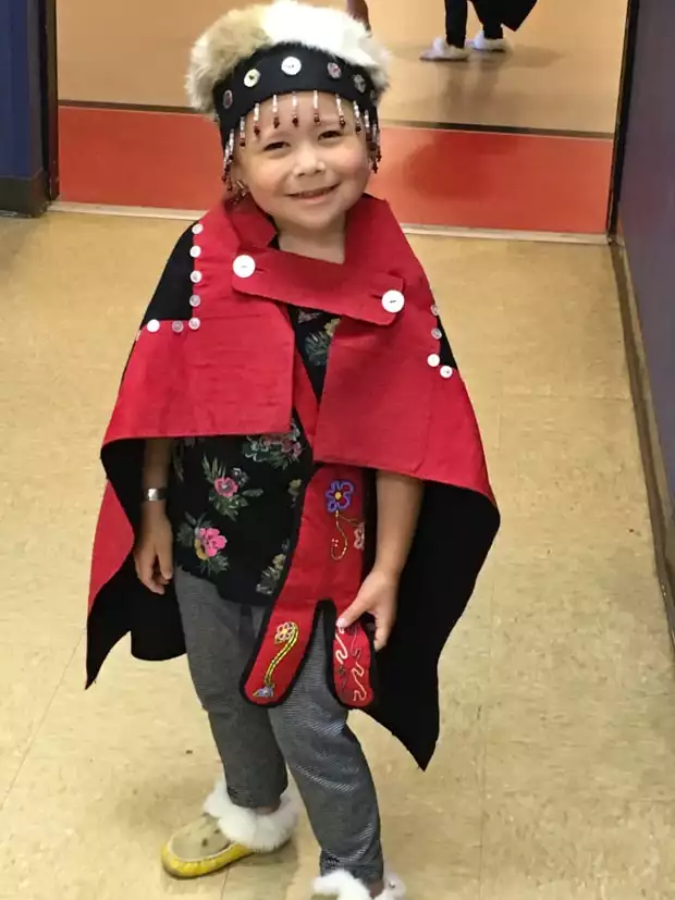 Tlingit child performer in traditional clothes in Alaska. 