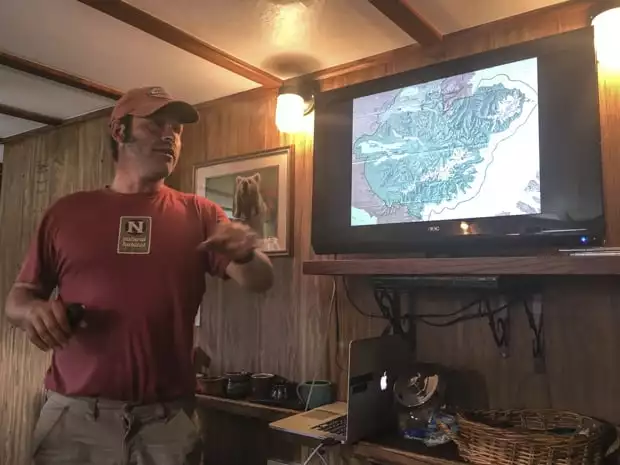 Guide giving a briefing before a grizzly tour from a small ship cruise in Alaska. 