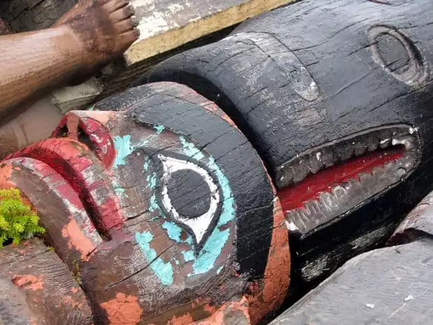 An up close picture of a totem pole in Alaska. 