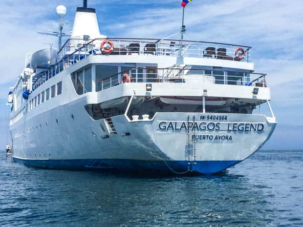 Stern view of the Galapagos Legend anchored in the ocean.