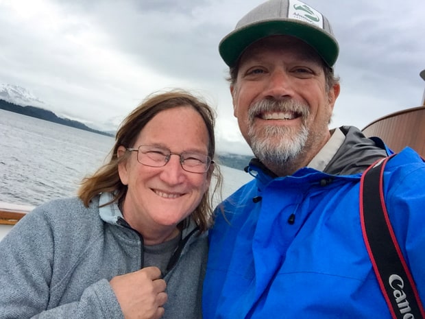 AdventureSmith Founder Todd Smith with captain of small ship Sea Wolf in Alaska. 