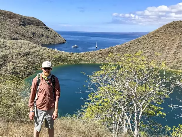 Galapagos traveler on a hike overlooking Sullivan Bay.