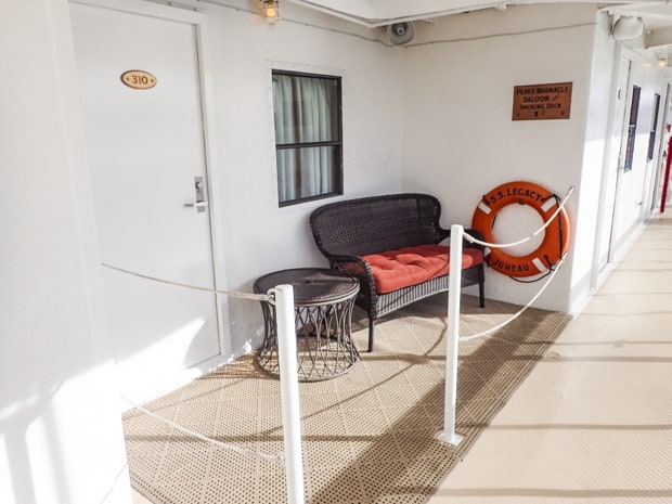 Lounge area on deck outside an Admiral cabin aboard S. S. Legacy. 