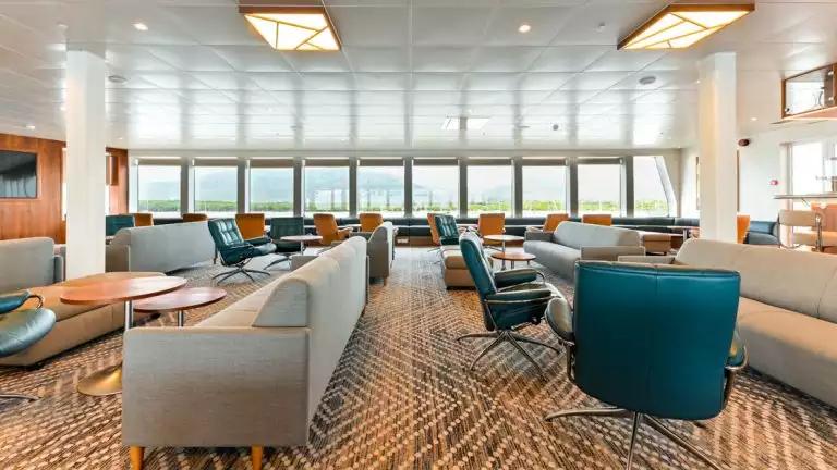 The lecture lounge features many comfortable seats where you can listen to the brief aboard the Coral Geographer off the coast of Australia