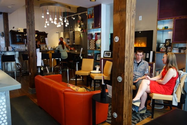 People sitting down at the wine bar and lounge at the Silverbow restaurant in Juneau Alaska. 