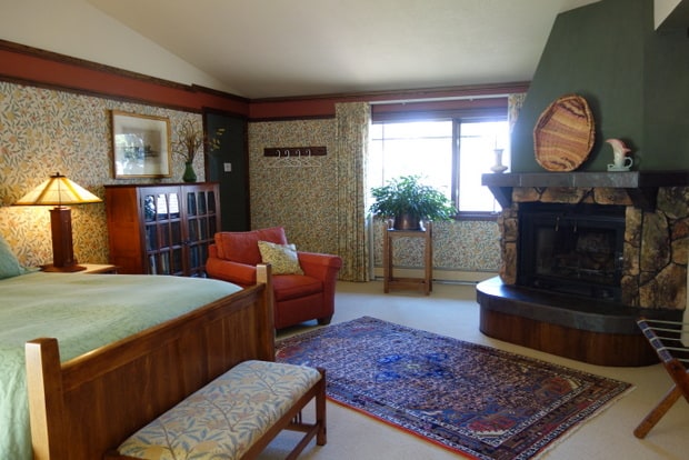 Inside room view of bed and fireplace at the Parkside Guest House bed and breakfast for guests of Camp Denali and North Face Lodge in Denali National Park Alaska. 