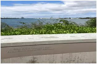 Waterfront of Pearl Harbor with inscription (not legible)