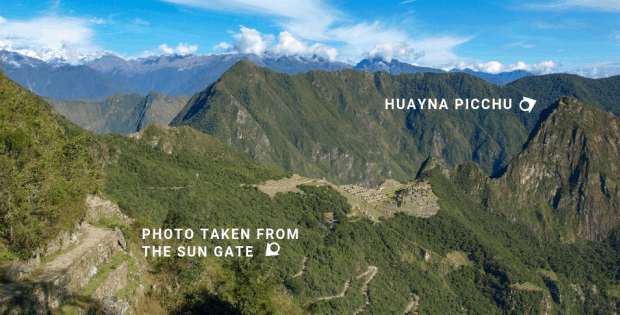 View from the Sun Gate with arrow showing location of Huayna Picchu at Machu Picchu. 