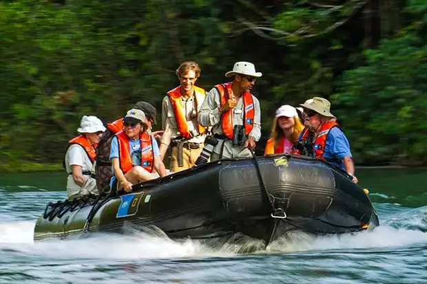 people aboard a zodiac on a costa rican river