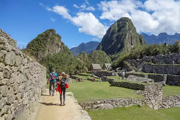 People hiking toward Huayna Picchu at Machu Picchu in Peru. 