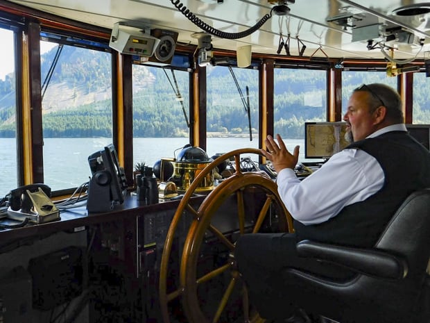 Captain Tim Voss on the bridge aboard small ship S.S. Legacy in Alaska. 